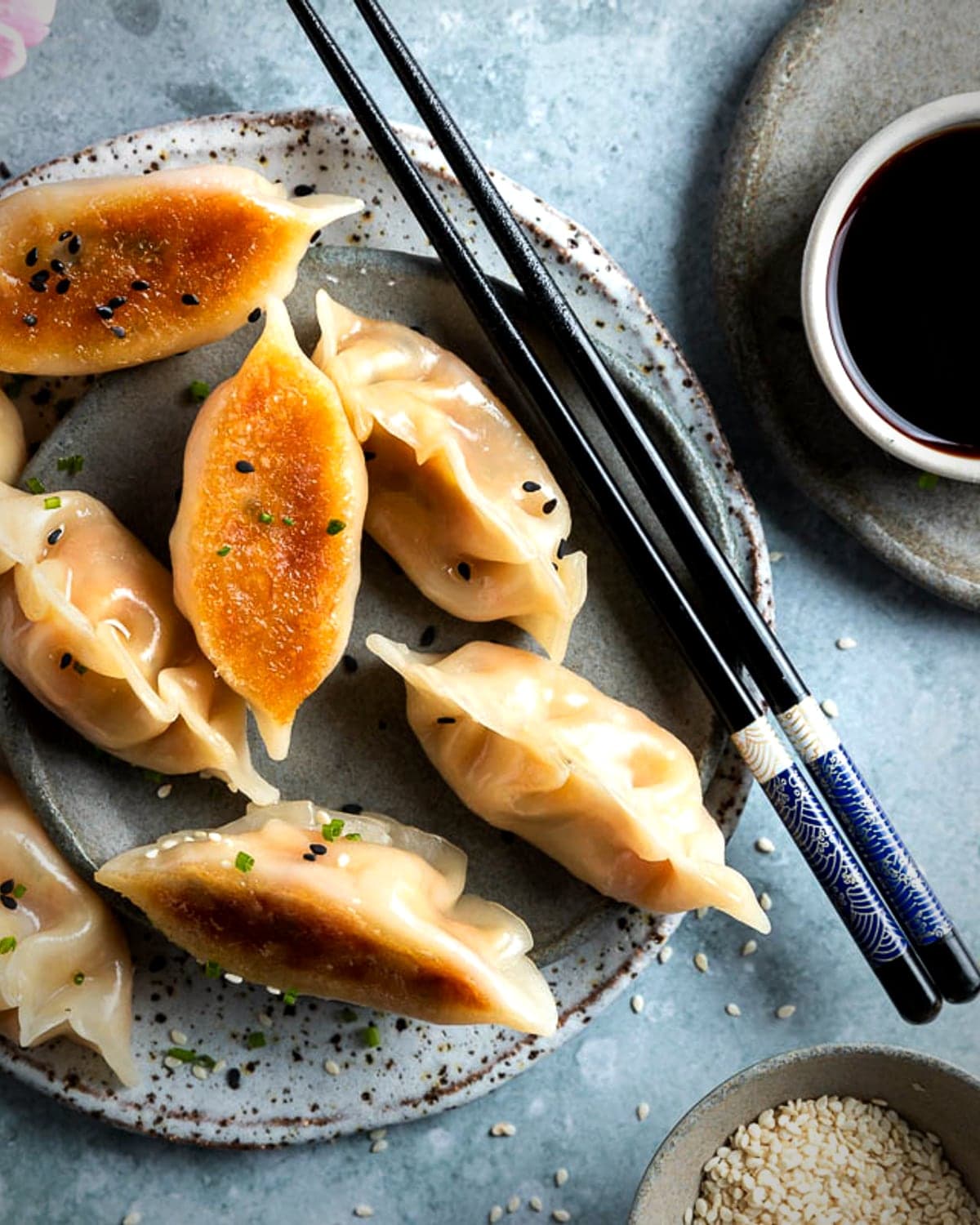 A shared plate of Daisuki appetizers: gyoza, takoyaki, and crab rangoon.