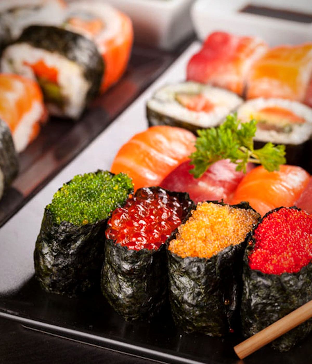The Rainbow roll at Daisuki Sushi, draped with assorted sliced fish.